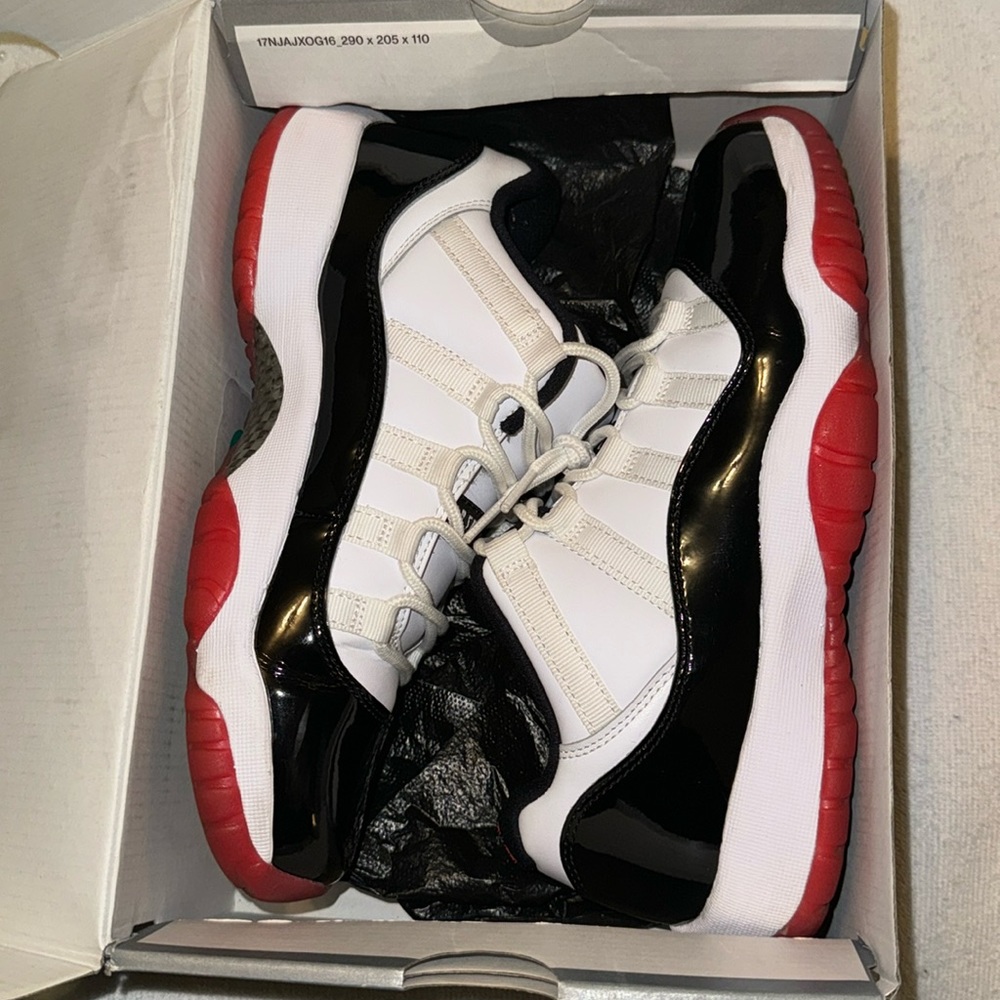 Air Jordan 11 retro low 
7 Y 
White, black, and red 
In box 
Barley